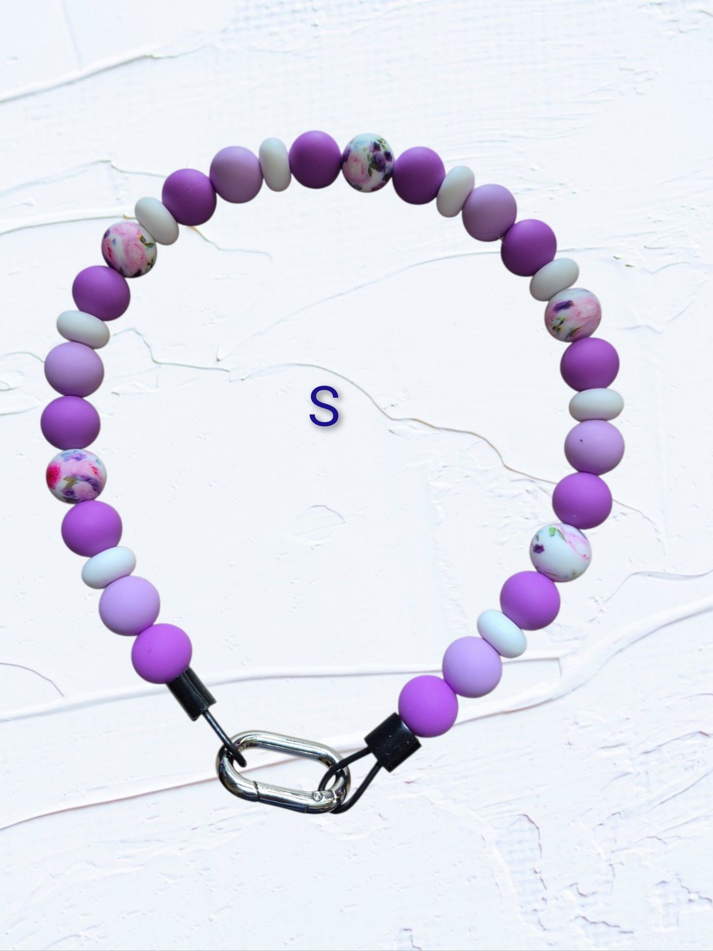 purple, lavender and white beads with multicolour floral accent beads and silver O-ring clasp