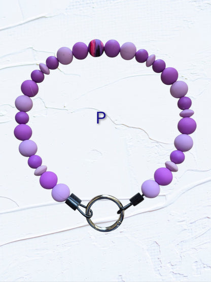 purple and lavender beads with multicolour swirl accent bead
