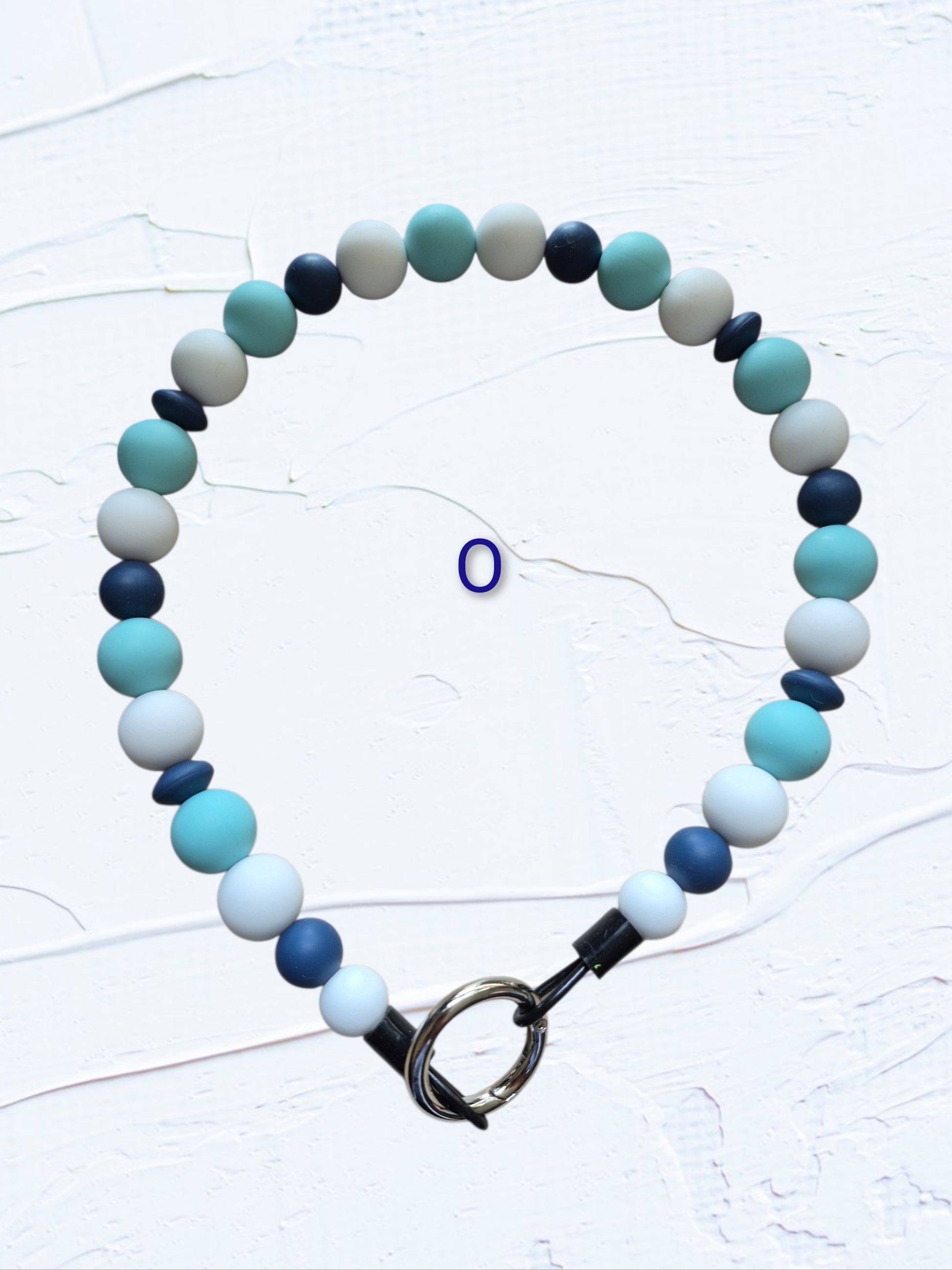 18 inch silicone beaded dog collar Colour O – teal, navy, grey and white beads with silver O-ring clasp, handmade in Canada