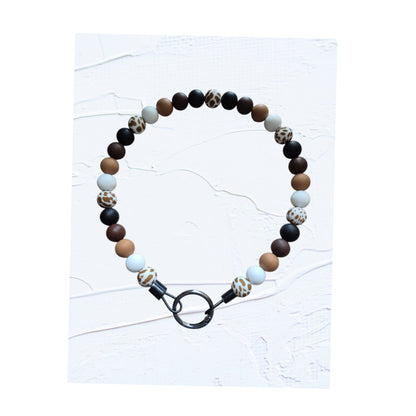 21 inch silicone beaded dog collars handmade in Canada – group shot showing Colour V in black, brown and leopard print and Colour W in blue tones, with O-ring clasps